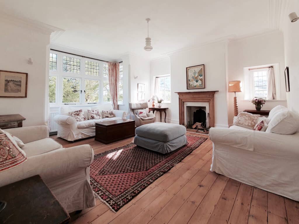 Huge light-filled sitting room with open fire for family gatherings