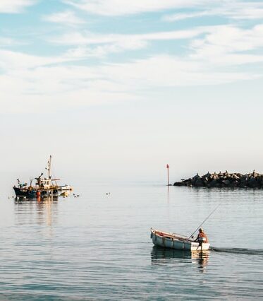 Fishing boats in a calm Lyme Harbour