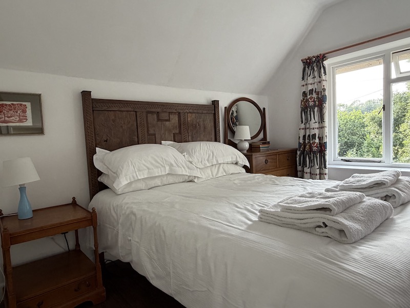 vintage wooden bedstead in bedroom